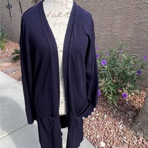 Blue long sleeved knee length knit sweater.